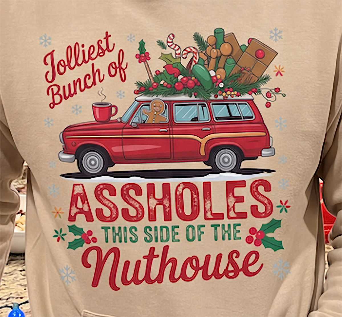 Close-up of sand funny Christmas hoodie with sarcastic family Christmas design