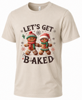 Sand Let’s Get Baked Christmas graphic T-shirt featuring two gingerbread characters dressed for the holidays.
