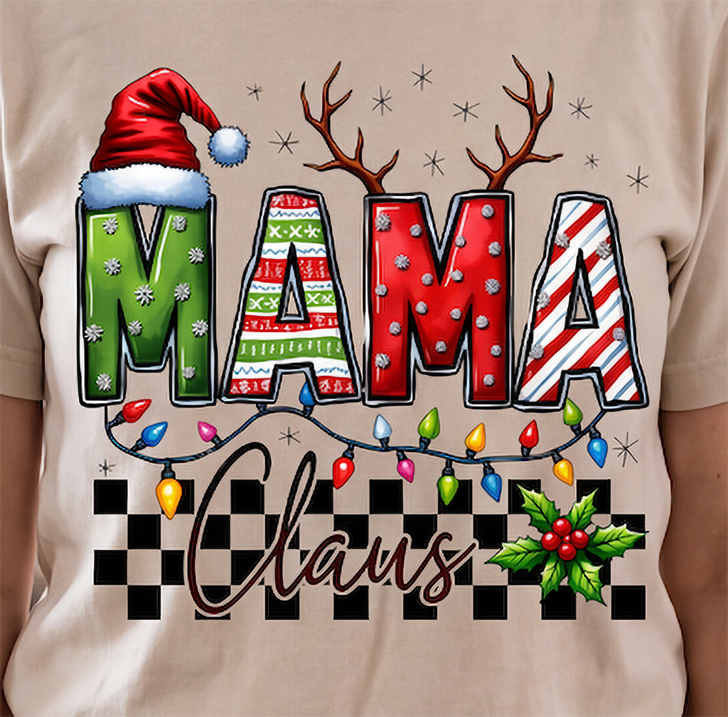 Close-up of sand Mama Claus Christmas shirt featuring colorful MAMA lettering, Christmas lights and checkered design.