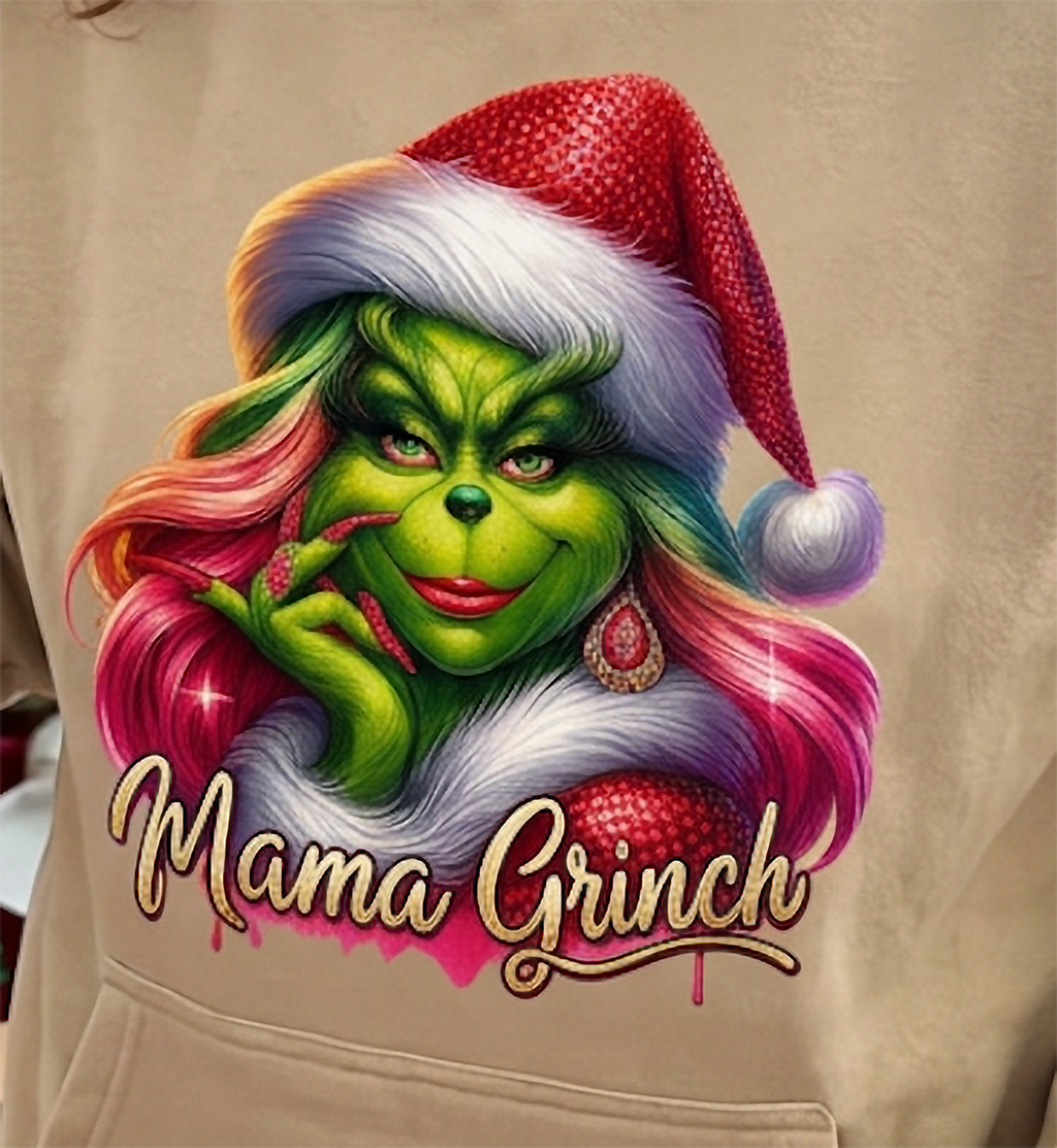 Close-up of Mama Grinch graphic on sand Christmas hoodie