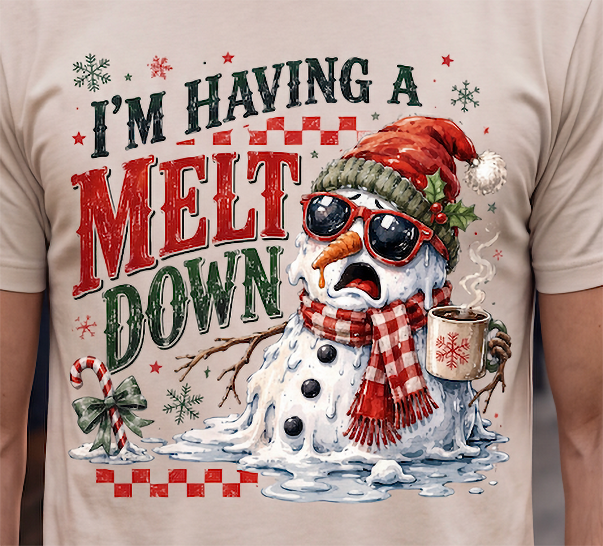 Close-up of sand I’m Having a Meltdown Christmas shirt featuring funny snowman holiday design