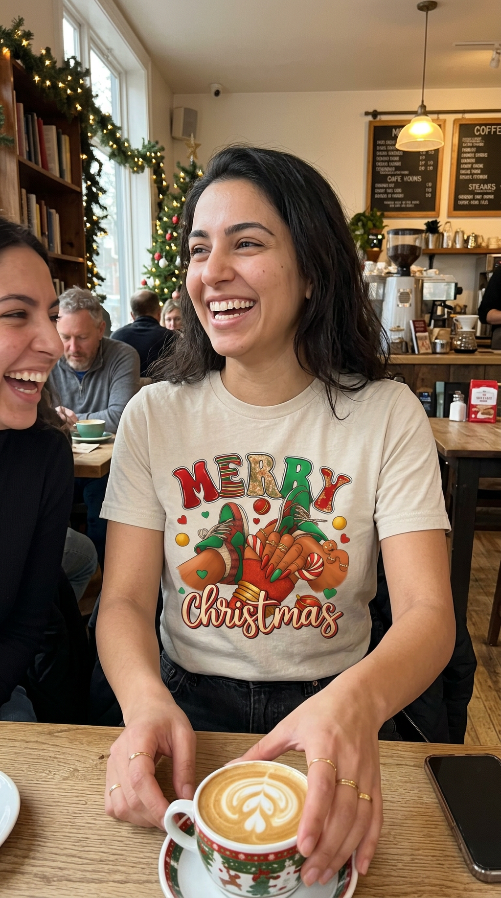 Lifestyle – Sand: Woman wearing a sand-colored Merry Christmas sneaker graphic t-shirt while celebrating the holiday season indoors.