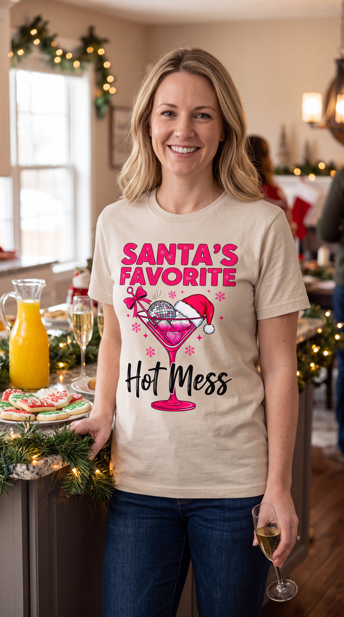 Woman wearing sand Santa’s Favorite Hot Mess Christmas shirt in a festive holiday setting.