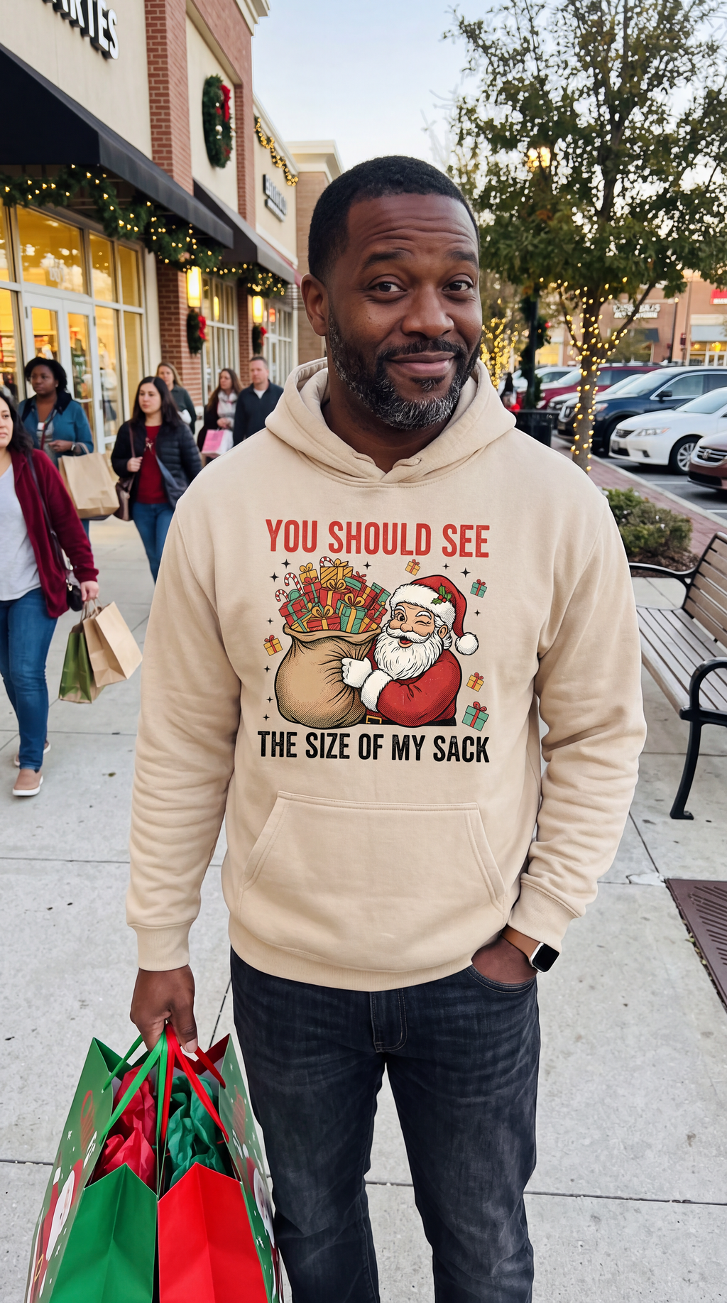 Man wearing sand funny Santa Christmas hoodie with adult holiday humor design