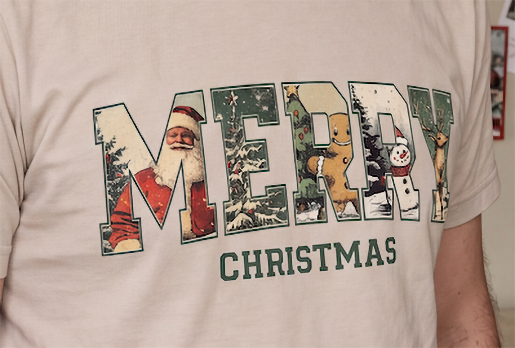 Close-up of sand Vintage Merry Christmas shirt showing the nostalgic retro Christmas graphic.