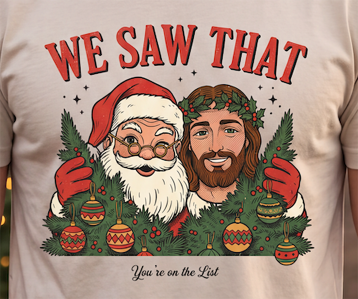 Close-up of Santa and Jesus We Saw That Christmas graphic on sand shirt