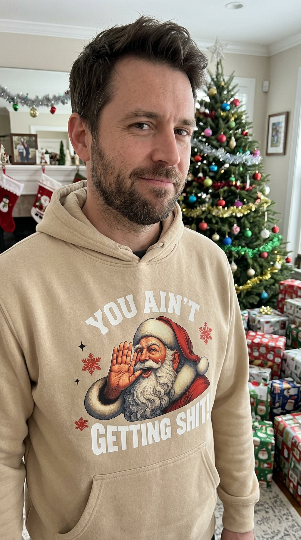 Man wearing sand You Ain’t Getting Shit Santa hoodie at a holiday party