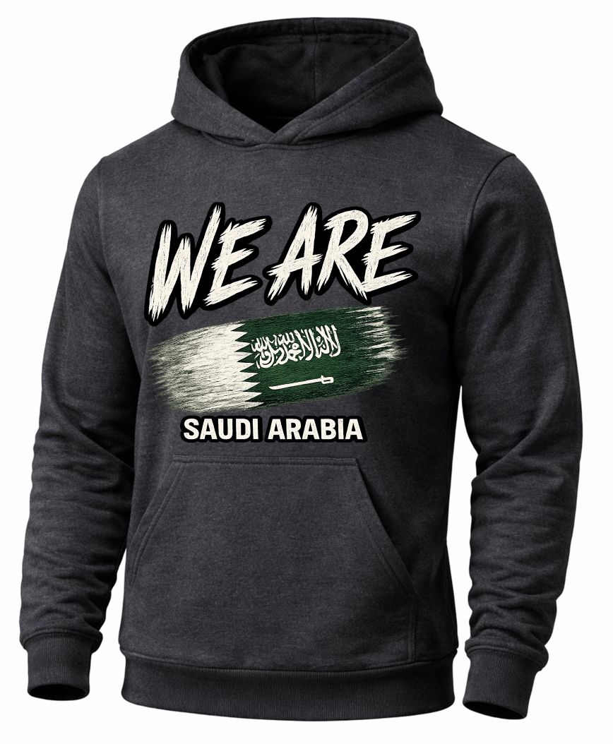 A dark gray heathered hoodie with a graphic print on the front. The design features the text 'WE ARE' in a distressed white font above a stylized green and white Saudi Arabian flag, with 'SAUDI ARABIA' printed below in white.