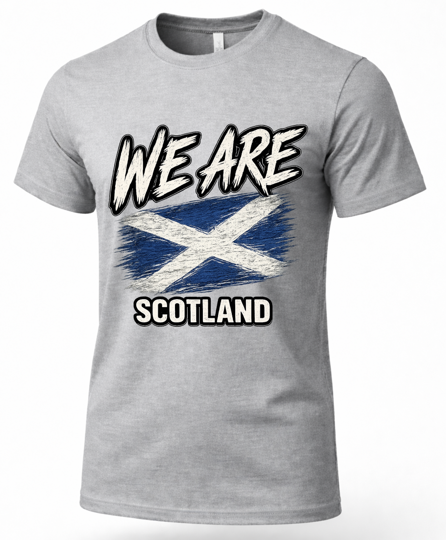 A heather gray short-sleeve crewneck t-shirt featuring a distressed graphic print of the Scottish flag with the text 'WE ARE SCOTLAND' in white and black.