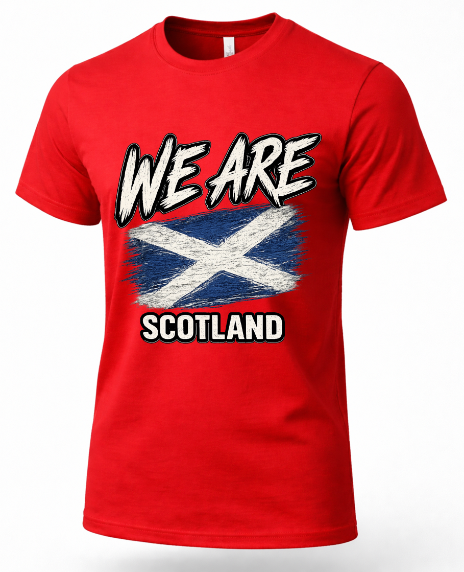 A red short-sleeve crewneck t-shirt featuring a distressed graphic print of the Scottish flag with the text 'WE ARE SCOTLAND' in white and black.
