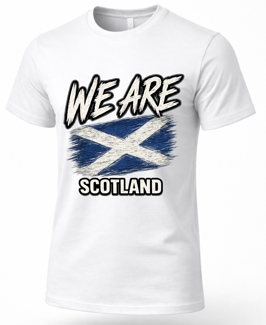 A white short-sleeve crewneck t-shirt featuring a distressed graphic print of the Scottish flag with the text 'WE ARE SCOTLAND' in a bold, stylized font.