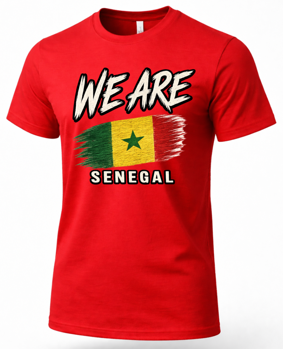 A red short-sleeve crewneck t-shirt featuring a graphic print of the Senegalese flag with a distressed brushstroke effect, accompanied by the text 'WE ARE' above and 'SENEGAL' below in a bold white font with black outlines.