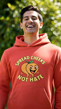 Man wearing red hoodie with ‘Spread Cheeks Not Hate’ peach graphic outdoors