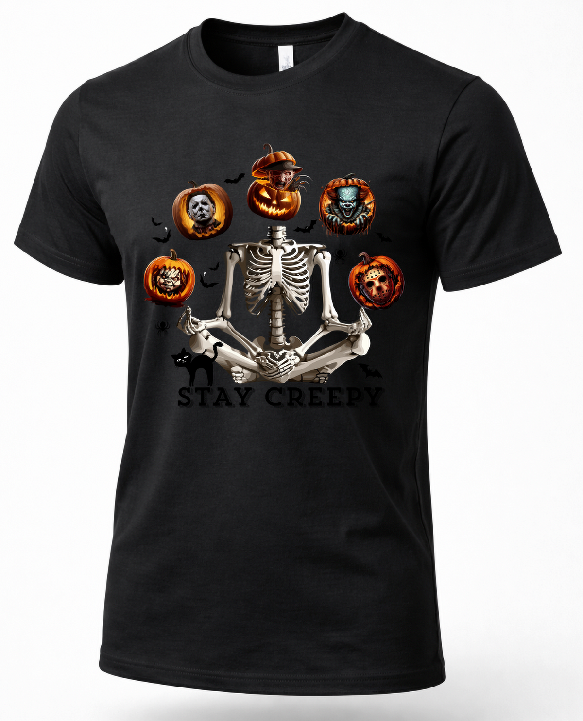 A black short-sleeve crewneck t-shirt featuring a Halloween graphic of a skeleton meditating, surrounded by jack-o'-lanterns with skull and demon faces, with the text 'STAY CREEPY' underneath.