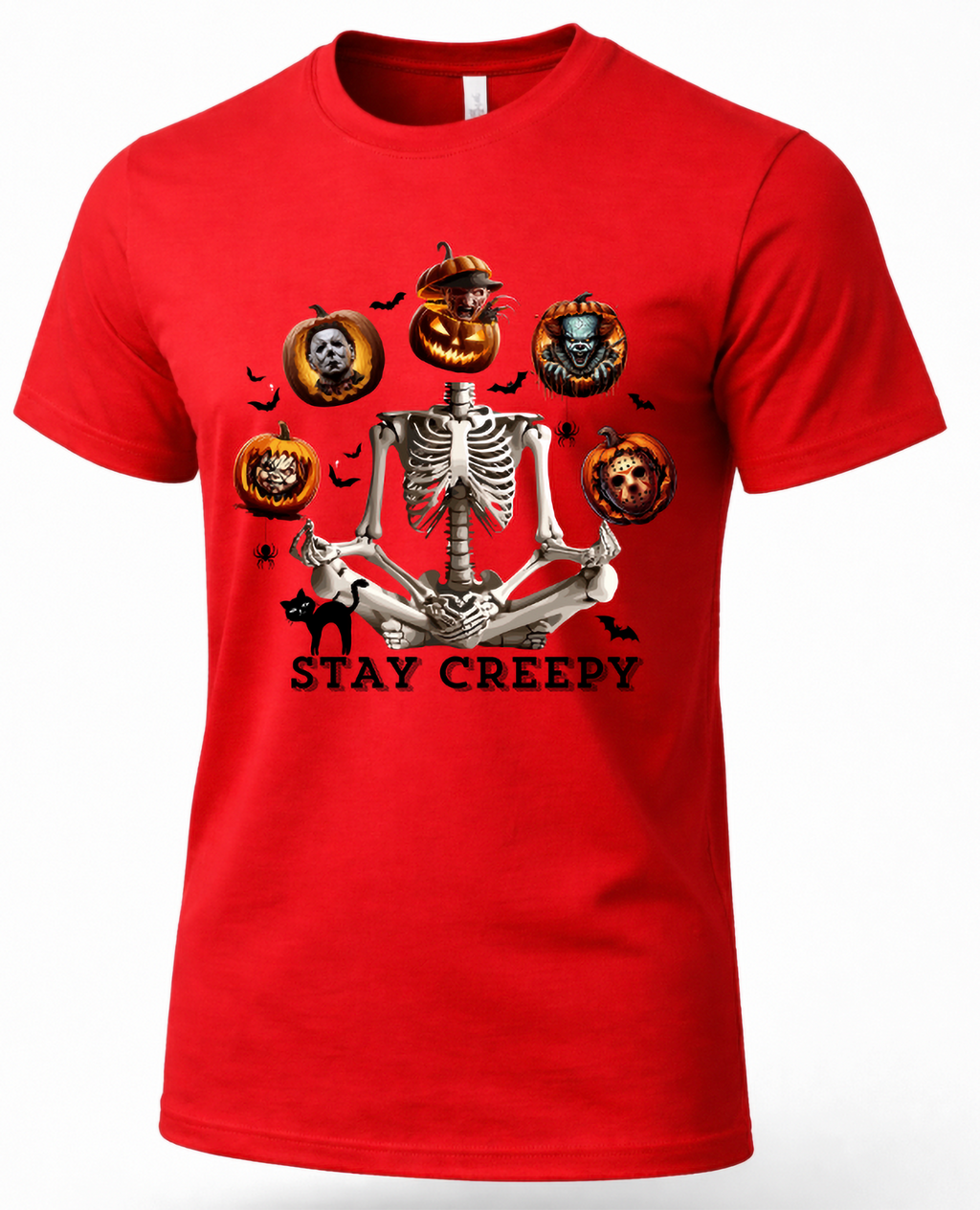 A red short-sleeve crewneck t-shirt featuring a Halloween graphic of a skeleton meditating, surrounded by jack-o'-lanterns, bats, and a black cat, with the text 'STAY CREEPY' printed below.