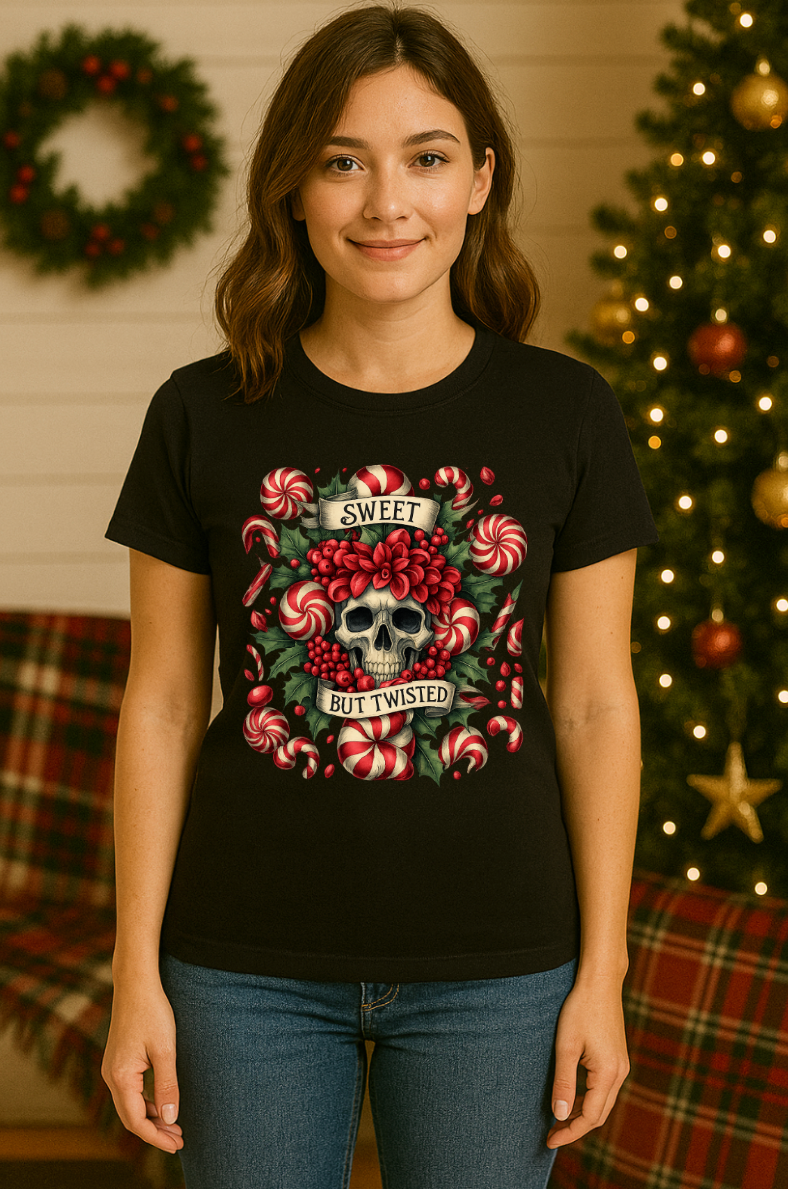 Black Christmas t-shirt featuring a skull with candy canes and holly, holiday flat-lay with ornaments, pine branches, and snowflakes.