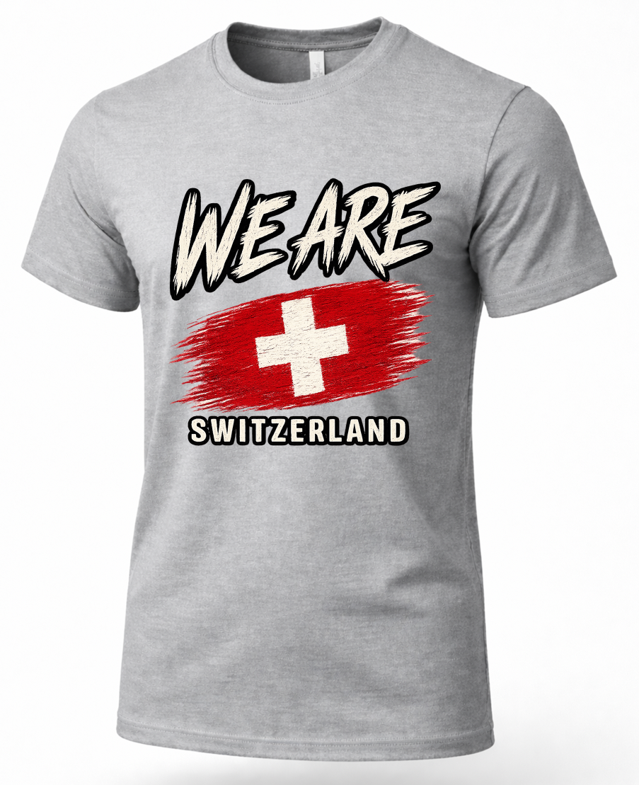 A heather gray short-sleeve crewneck t-shirt featuring a graphic print of the Swiss flag with the text 'WE ARE' above and 'SWITZERLAND' below, displayed on a clean white background.