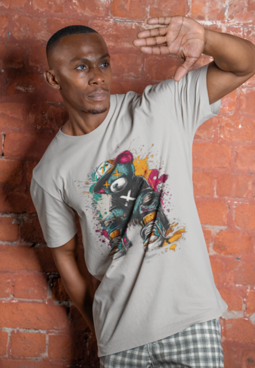 Man wearing gray graffiti teddy bear streetwear graphic tee urban street fashion