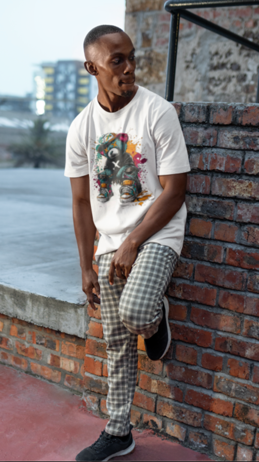 Man wearing white graffiti teddy bear streetwear graphic tee urban street fashion