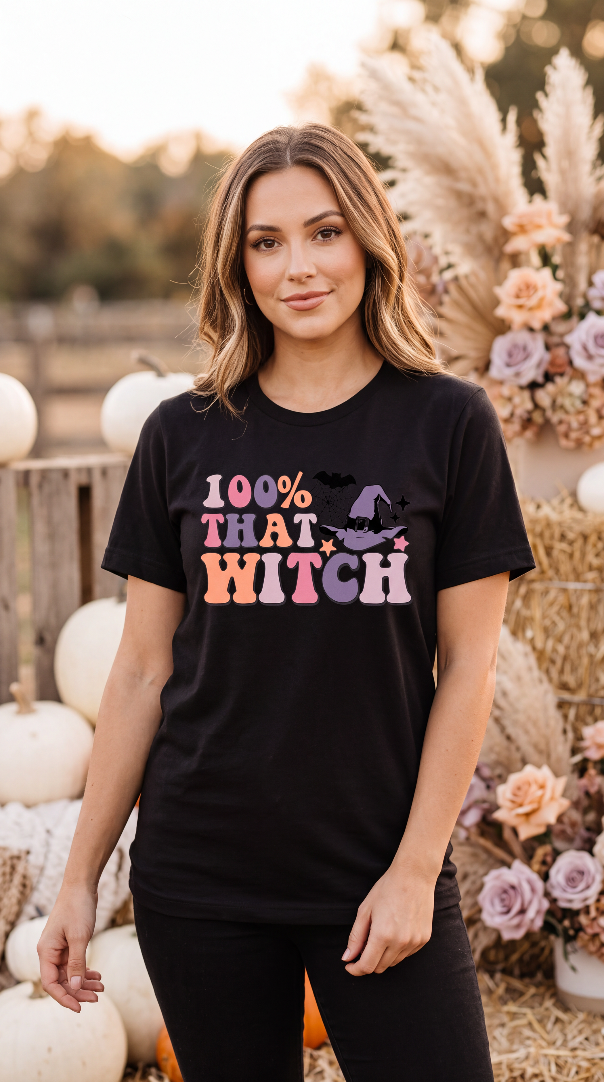 Female model wearing black 100% That Witch Halloween shirt with retro witch hat graphic