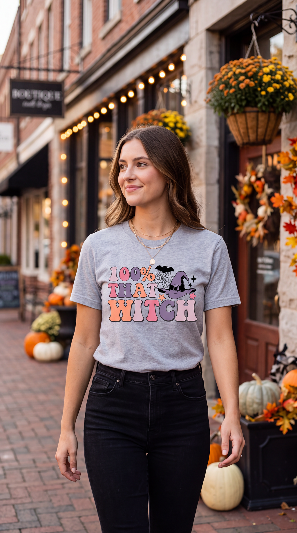 Female model wearing black 100% That Witch graphic tee for Halloween