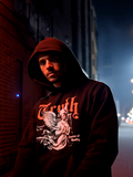 Man wearing black Truth graphic hoodie with angel design in a dark urban alley at night