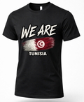 A black short-sleeve crewneck t-shirt featuring a distressed graphic print of the Tunisian flag and the text 'WE ARE' and 'TUNISIA' in white.