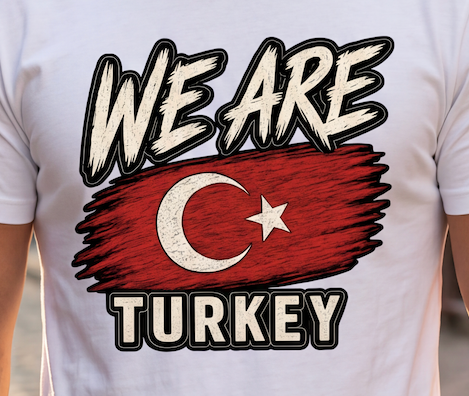 A close-up of a white t-shirt featuring a graphic print that reads 'WE ARE TURKEY' with a stylized Turkish flag in the center, worn by a person.
