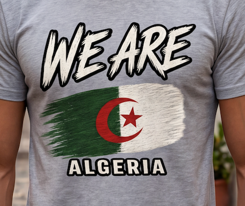 A close-up of a person wearing a heather gray t-shirt with a graphic print of the Algerian flag and the text 'WE ARE ALGERIA' in white with black outlines.