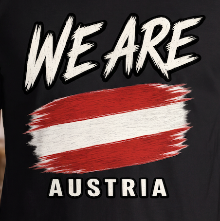 A close-up of a black t-shirt featuring a graphic print with the words 'WE ARE' and 'AUSTRIA' in white, surrounding a red and white striped paint-stroke design resembling the Austrian flag.