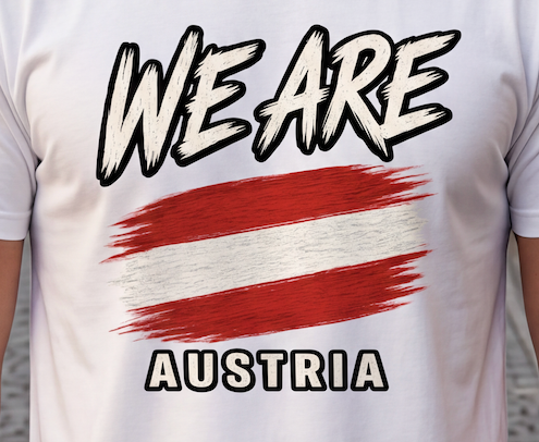 A close-up of a white short-sleeve t-shirt worn by a person, featuring a graphic print with the words 'WE ARE' and 'AUSTRIA' in a stylized black-and-white font, with a red-and-white striped brushstroke design in the center.
