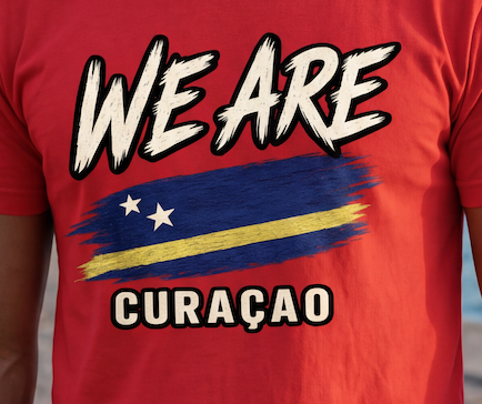 A close-up of a red t-shirt featuring a graphic print with the text 'WE ARE' above a stylized flag design and 'CURAÇAO' below.