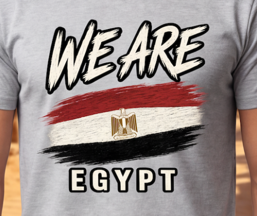 A close-up of a gray t-shirt featuring a graphic print of the Egyptian flag with the text 'WE ARE' above and 'EGYPT' below, worn by a person.