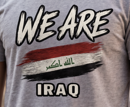 Close-up of distressed Iraq flag heritage graphic printed on premium WE ARE T-shirt.