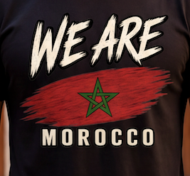 Close-up of a black t-shirt featuring a graphic print with the text 'WE ARE MOROCCO' and the Moroccan flag design.