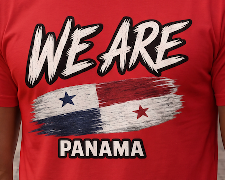 A close-up of a red t-shirt featuring a graphic print with the text 'WE ARE PANAMA' and a stylized flag design with blue and red stars.