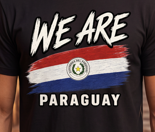 A close-up of a black t-shirt featuring a graphic print with the text 'WE ARE' and 'PARAGUAY' in white, and a stylized flag design in red, white, and blue with the Paraguay national emblem in the center.
