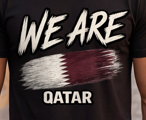 A close-up of a black t-shirt featuring a graphic design with the text 'WE ARE QATAR' in white, with a stylized Qatar flag in the center.
