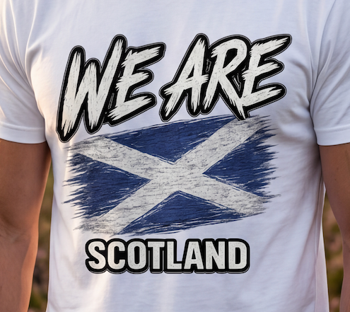 A close-up of a white crewneck t-shirt featuring a distressed graphic print of the Scottish flag with the text 'WE ARE SCOTLAND' in a bold, stylized font.