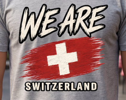 A close-up of a person wearing a heather gray t-shirt with a graphic print that reads 'WE ARE' above a red and white Swiss flag design, and 'SWITZERLAND' below.