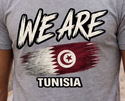 A close-up of a person wearing a heather gray t-shirt with a graphic print. The graphic features the text 'WE ARE' in a bold, distressed white font with black outlines, above a stylized, brush-stroke style flag of Tunisia in red, white, and gray.