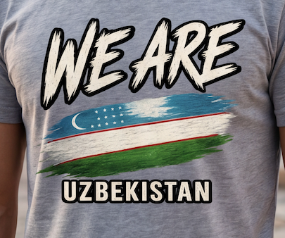 A close-up of a heather gray t-shirt featuring a graphic print with the text 'WE ARE' above a stylized flag of Uzbekistan and 'UZBEKISTAN' below.