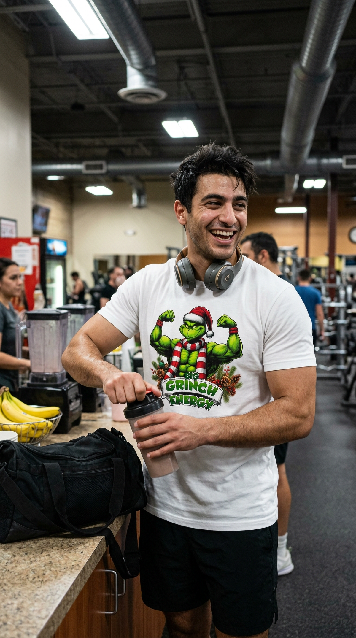 Man wearing white Big Grinch Energy Christmas t-shirt at the gym featuring a muscular Grinch design for holiday fitness enthusiasts.