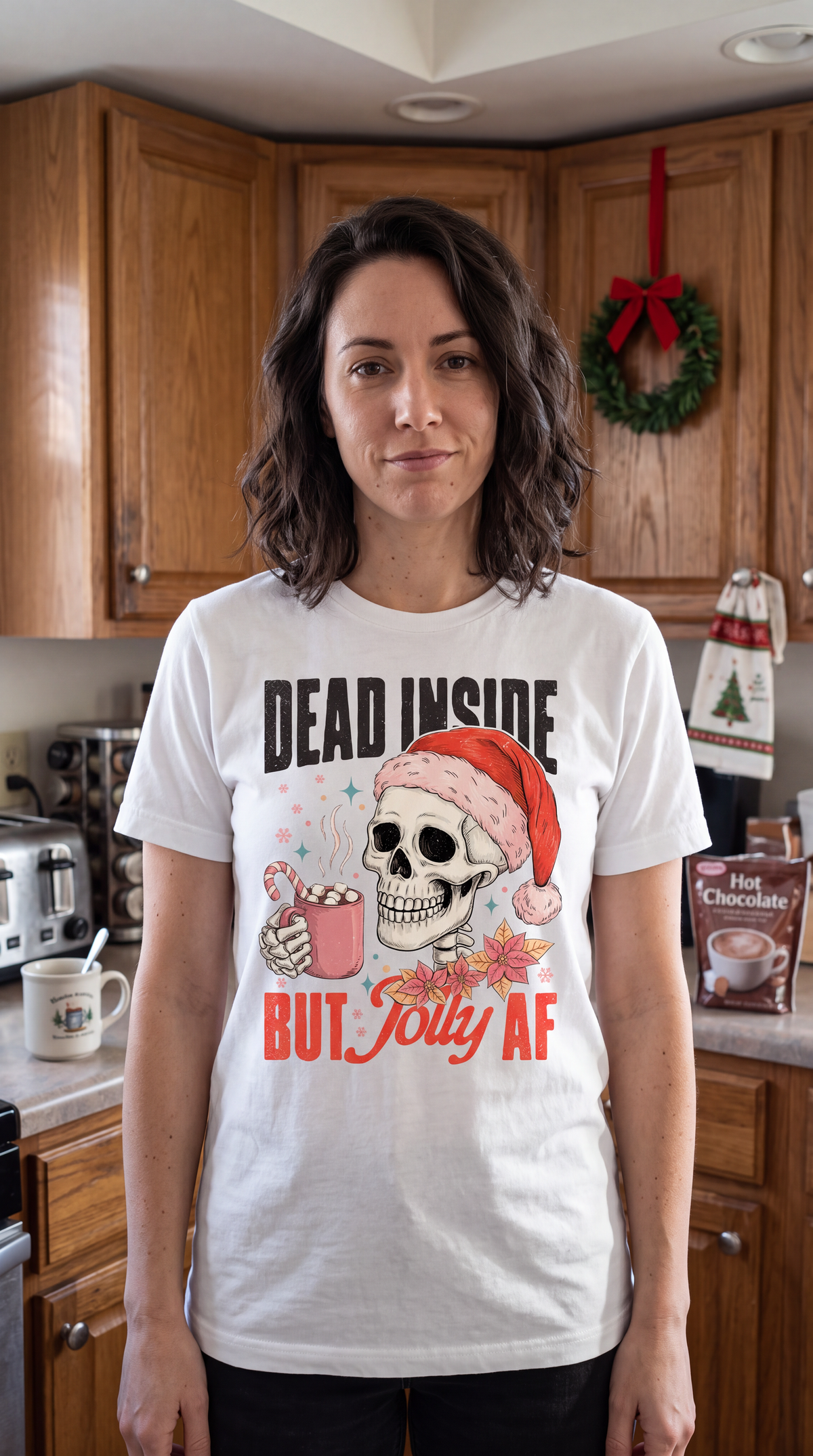 Woman wearing white Dead Inside But Jolly AF funny skeleton Christmas graphic shirt.
