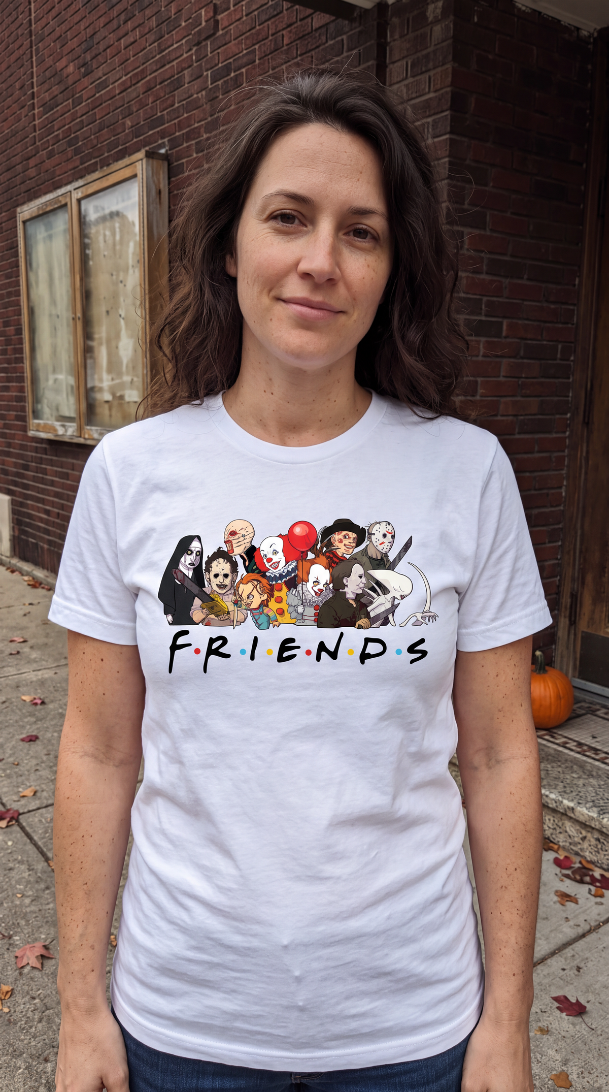 Woman wearing white Horror Friends Halloween graphic tee