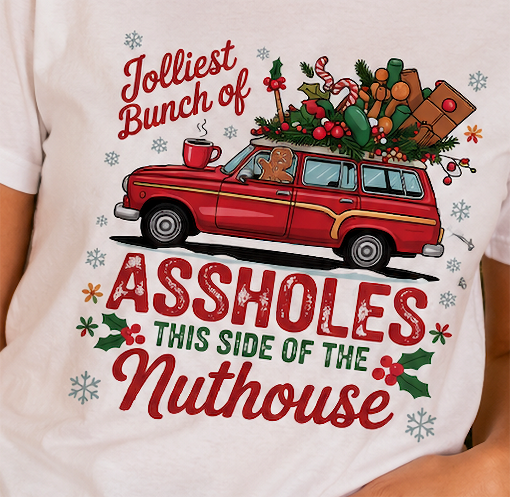 Close-up of Jolliest Bunch of Assholes Christmas shirt graphic with festive station wagon and holiday decorations.