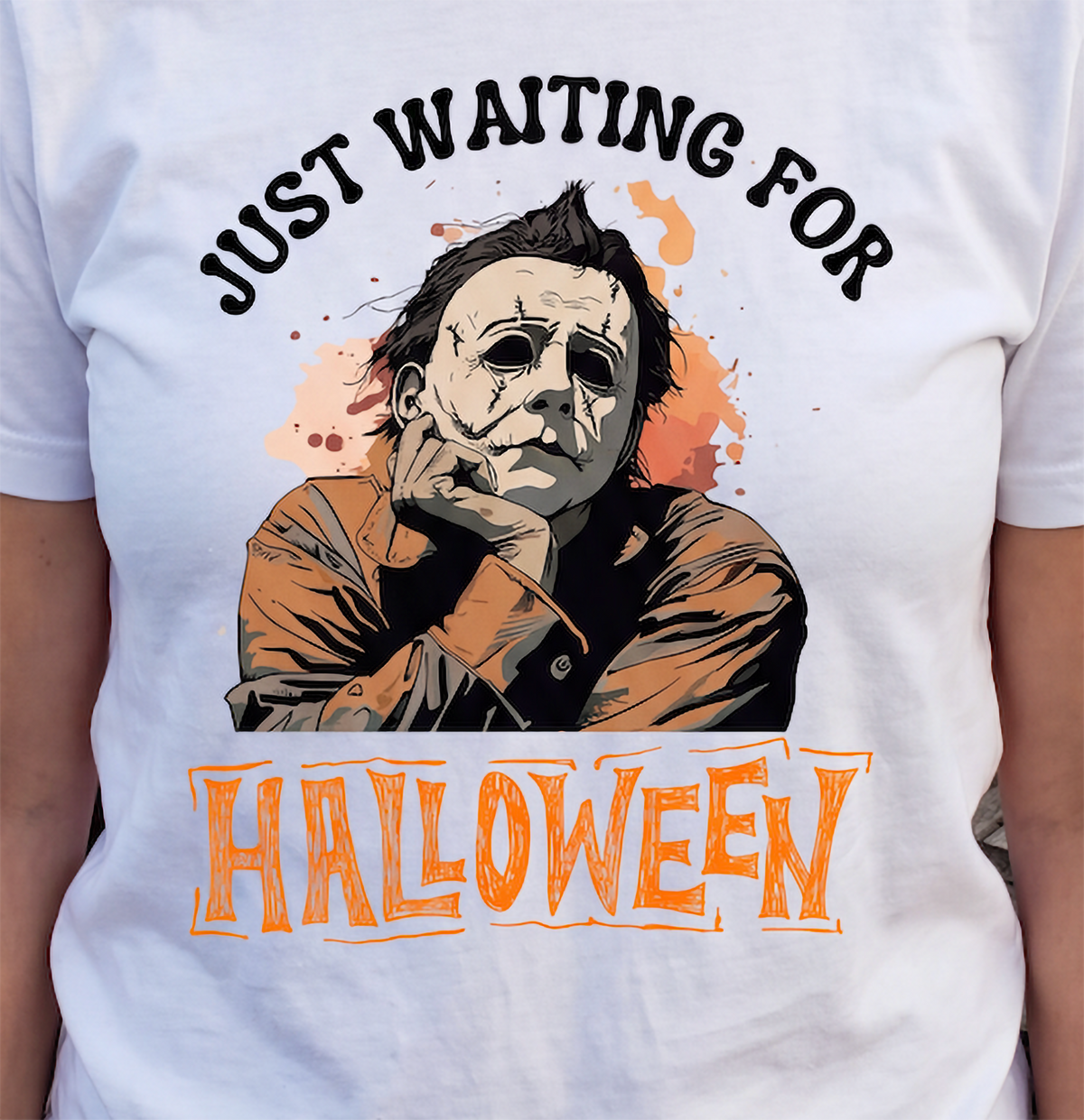 Close-up of white Michael Myers Halloween shirt with spooky season design