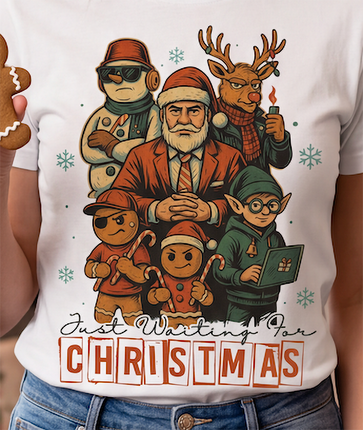 Close-up of white funny Christmas shirt with festive Santa, reindeer, elf, snowman and gingerbread artwork.