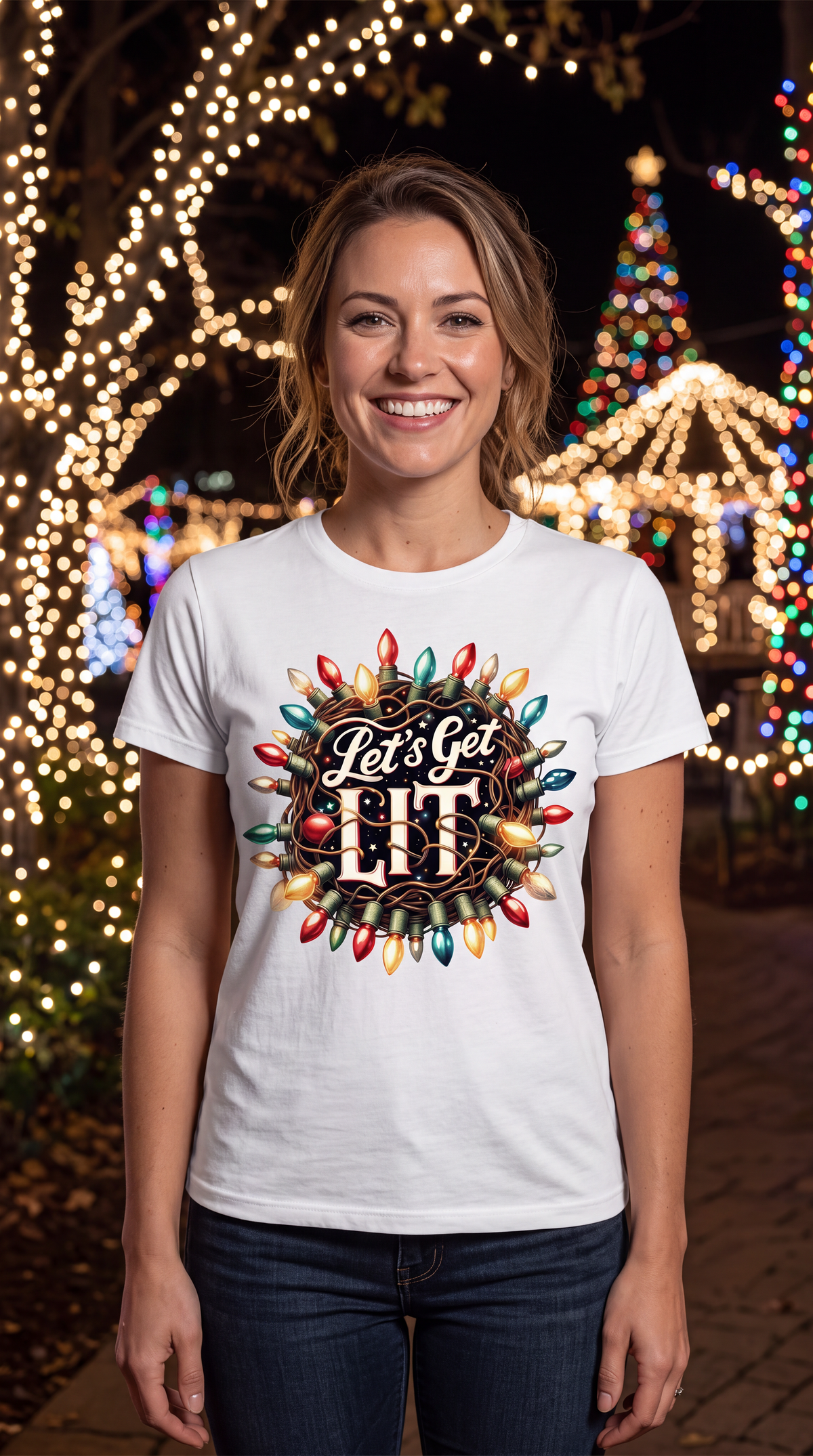 Woman wearing white Let’s Get Lit Christmas graphic T-shirt in a festive holiday setting