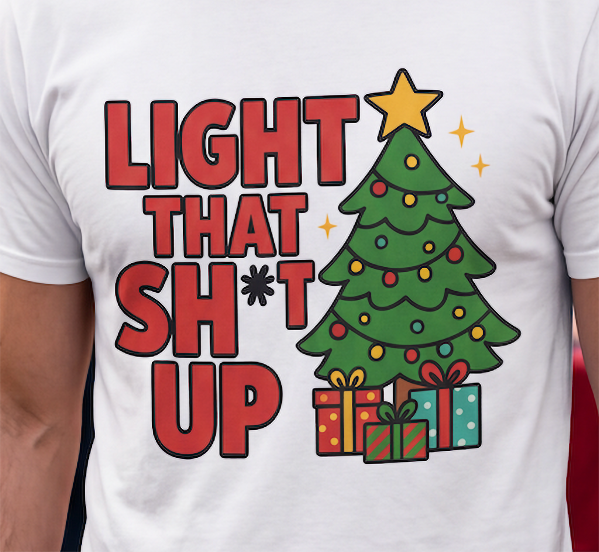 Close-up of white Light That Shit Up Christmas shirt with decorated tree and bold holiday graphic.